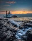 Minnesota-Lake Superior Lake waves and rocks at sunrise Art Print